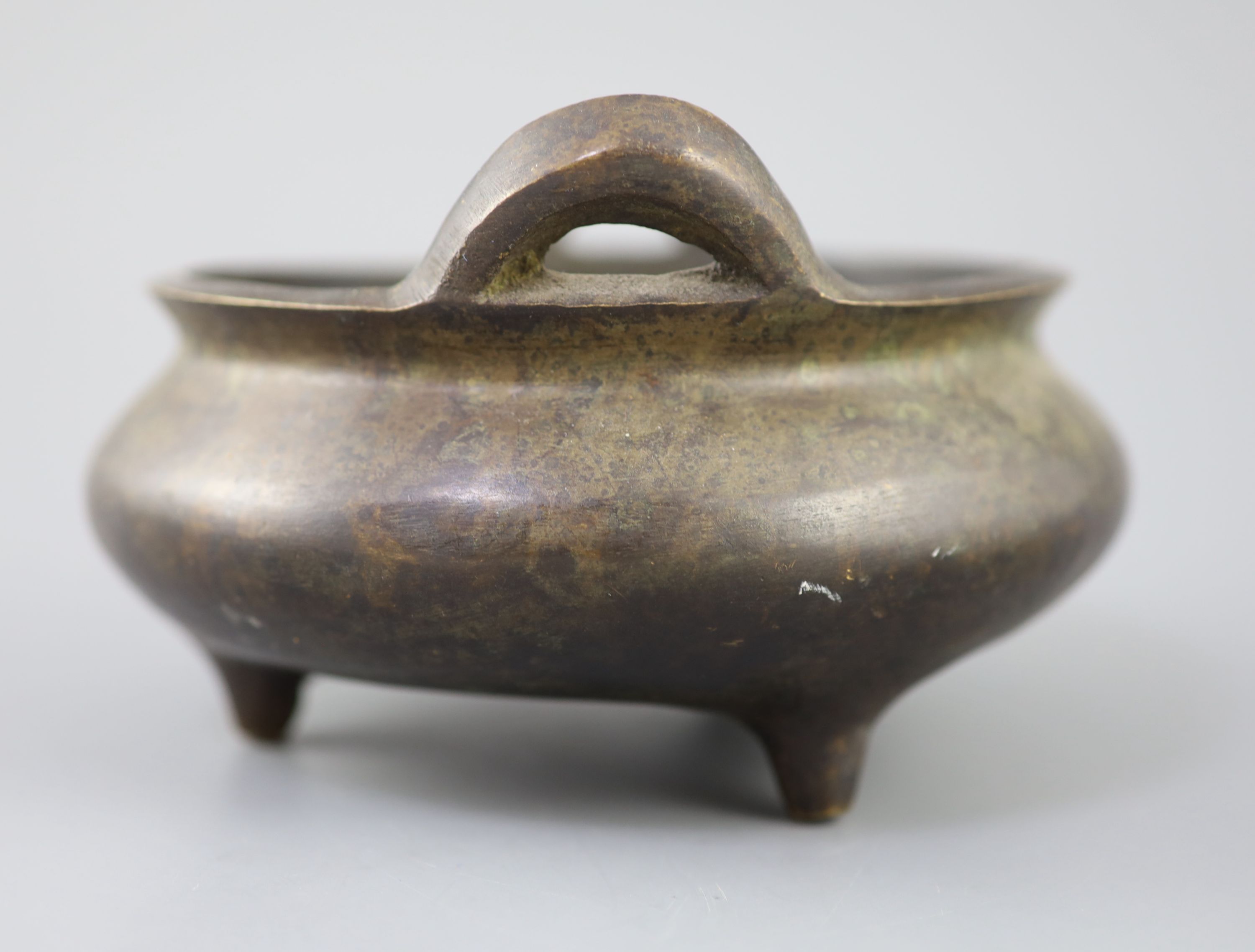 A Chinese bronze tripod censer, Xuande mark but 19th century, 16cm diameter